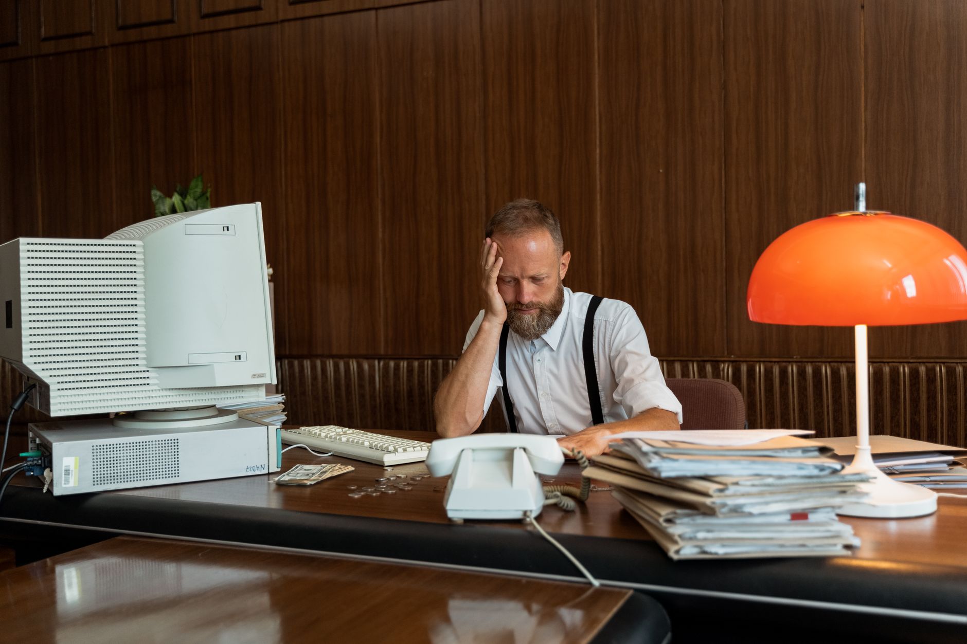 Image Generation Prompt: Back view of an export manager looking troubled in front of a monitor displaying complex certification documents and a California customs notice